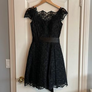 Gorgeous lace dress with full skirt and built in crinoline.